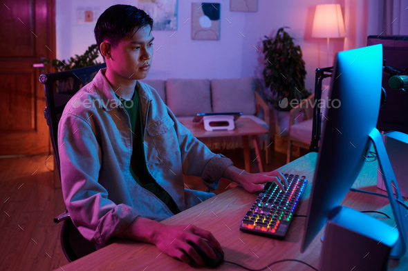 Teenage Boy Working on Computer - Stock Photo - Images