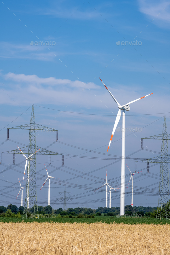 Wind turbines, power lines and electricity pylons - Stock Photo - Images