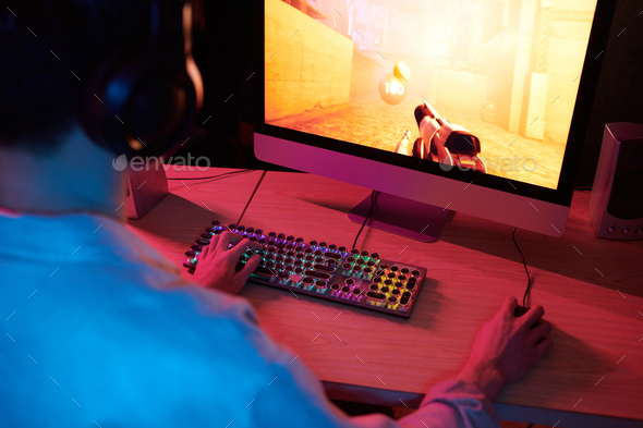 Boy Playing First Person Shooter Videogame - Stock Photo - Images
