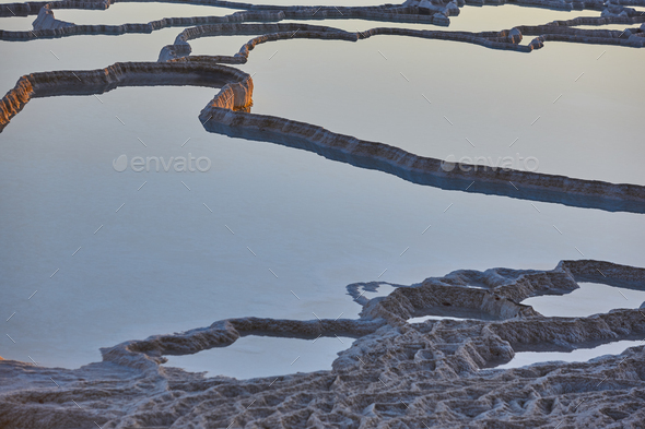 Pamukkale white mineral limestone natural pool at sunset. Turkey - Stock Photo - Images
