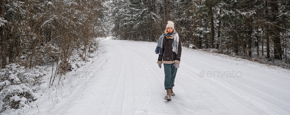 Winter.woman walks through winter snowy forest. Mental and physical health. Unity with nature.travel - Stock Photo - Images