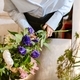 White young woman making bouquet with fresh flowers in florist shop - PhotoDune Item for Sale