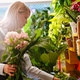 White beautiful young florist girl making bouquet with flowers in shop - PhotoDune Item for Sale
