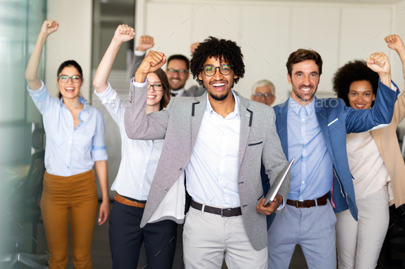 Happy group of business team celebrating a good job in the office. Business and finance concept. - Stock Photo - Images
