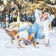 Happy woman in winter clothes having fun with sleigh against background of snowy winter forest - PhotoDune Item for Sale