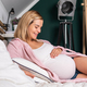 Happy pregnant woman in her bed expecting baby soon - PhotoDune Item for Sale