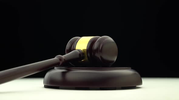 Wooden Hammer Revolves . Black Background alt