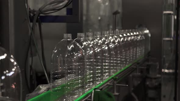 Plastic Containers Bottles Go Sequentially Row Along Production Conveyor Line
