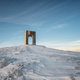 Monument Arch of Freedom at snow-covered mountain slope - PhotoDune Item for Sale