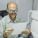Man examining eyesight in optical clinic. - PhotoDune Item for Sale