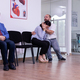 Woman crying in husband arms sitting in hospital waiting area - PhotoDune Item for Sale