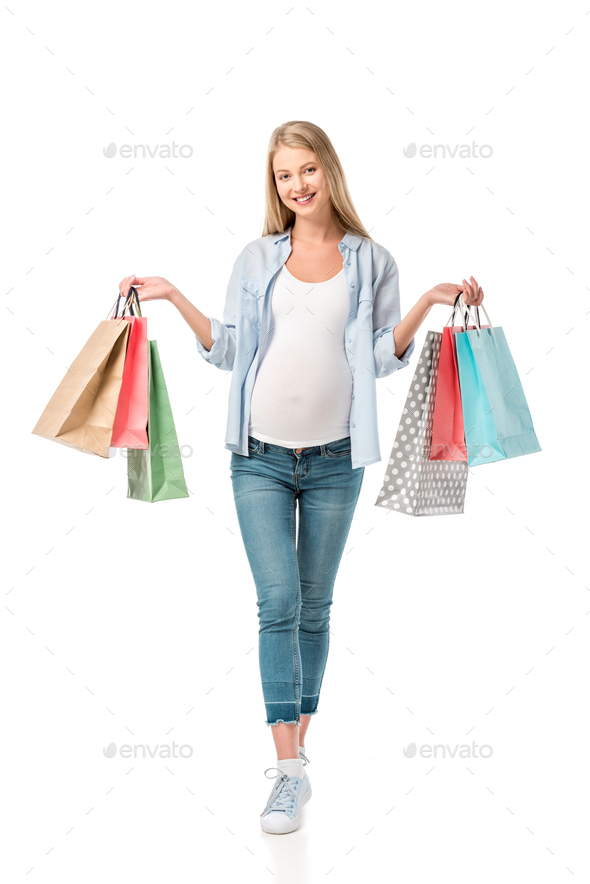 beautiful pregnant girl holding shopping bags isolated on white Stock