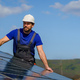 Man worker installing solar photovoltaic panels on roof, alternative energy concept. - PhotoDune Item for Sale