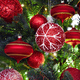 Christmas background. Xmas tree decoration red baubles and lights close up - PhotoDune Item for Sale