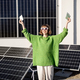 Happy household owner with money near solar power plant - PhotoDune Item for Sale