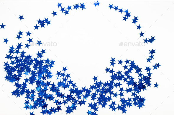 Christmas frame with blue star confetti. Holiday background for New