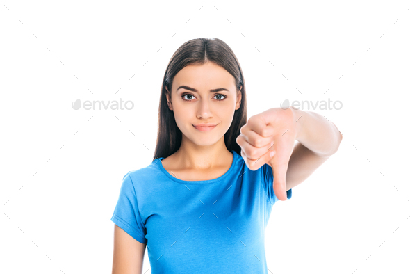 portrait of attractive woman showing thumb down isolated on white - Stock Photo - Images