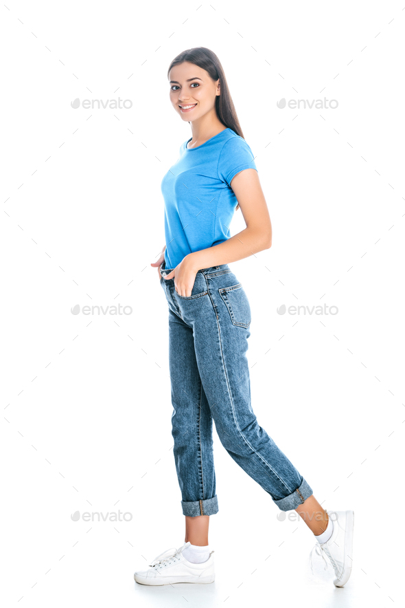 side view of stylish woman in jeans isolated on white - Stock Photo - Images