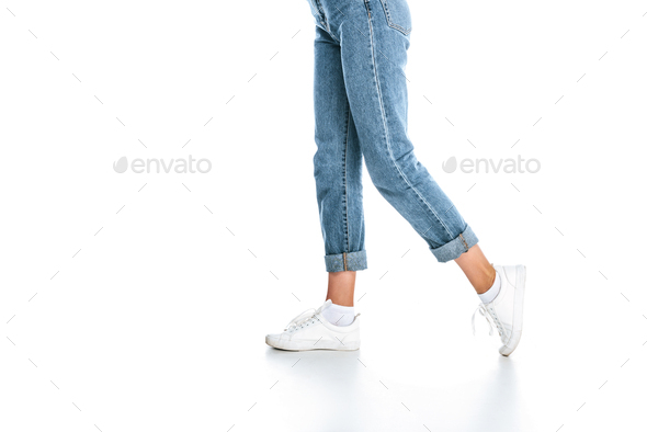 partial view of stylish woman in jeans isolated on white - Stock Photo - Images