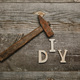 Top view of rusty hammer and diy sgn on wooden background - PhotoDune Item for Sale