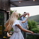 Young couple dancing outdoors, weekend away in tiny house in countryside, travel and holiday concept - PhotoDune Item for Sale