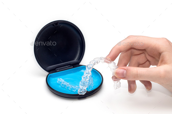 Transparent aligners and storage case. Invisible braces. Clear teeth straighteners.