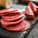 Sliced mexican salami with beans on cutting board. - PhotoDune Item for Sale