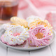 Different colors meringues with sprinkles on plate. - PhotoDune Item for Sale