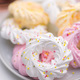 Different colors meringues with sprinkles on plate. - PhotoDune Item for Sale