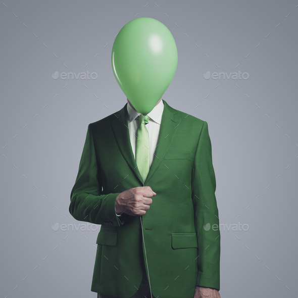 Anonymous businessman with a balloon in front of his head - Stock Photo - Images