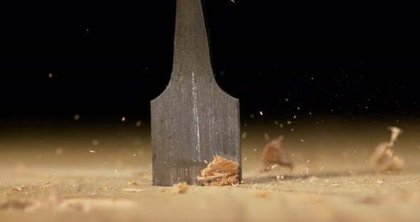 Wood Chip Turning on a Wood Board, Making Chips, Slow Motion 4K alt