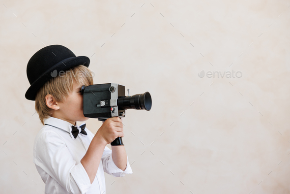 Newsboy shouting against grunge wall background. Boy selling newspaper - Stock Photo - Images