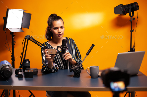 Influencer holding microphone Stock Photo by DC_Studio | PhotoDune