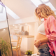 Portrait of pregnant woman standing at home holding hands on her belly - PhotoDune Item for Sale
