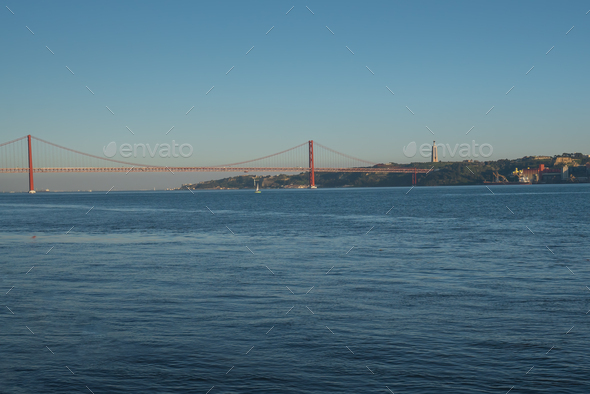 Tagus River with 25 de Abril Bridge and Sanctuary of Christ the King - Lisbon, Portugal - Stock Photo - Images