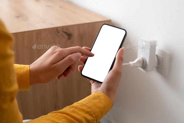 Woman controlling a smart plug from her phone