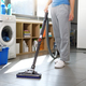Woman vacuuming the floor at home - PhotoDune Item for Sale