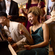 Group Of Friends Around Piano Celebrating At New Year Party Together - PhotoDune Item for Sale
