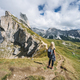 Women hiker on hiking trail path and epic landscape of Seceda peak in Dolomites Alps, Odle mountain - PhotoDune Item for Sale