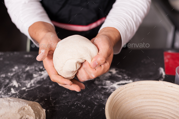 Kneading sourdough for loaf of bread.