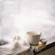 Cup of hot tea and an open book with a warm sweater on a vintage wooden windowsill - PhotoDune Item for Sale