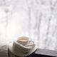 Cup of hot tea with a warm sweater on a vintage wooden windowsill - PhotoDune Item for Sale
