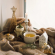 Hot tea, candles, Christmas golden balls and decorations. Christmas holiday mood. - PhotoDune Item for Sale