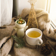 Hot tea, candles, Christmas golden balls and decorations. Christmas holiday mood - PhotoDune Item for Sale