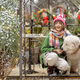 Woman and dog at beautiful garden decorated for winter holidays - PhotoDune Item for Sale