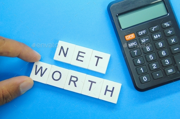 calculator and the word net worth. computational management concept