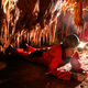 Paleontolgist studying fossils in a cave - PhotoDune Item for Sale