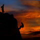 Climber waiting his partner on the summit. Beautiful sunset in the background - PhotoDune Item for Sale
