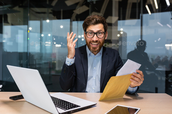 Portrait of happy mature investor businessman in office, man looking at camera and shocked happy