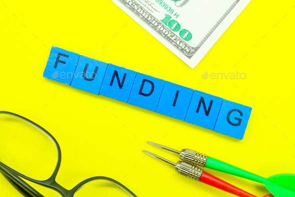 money, arrows and glasses with the word funding.  - Stock Photo - Images